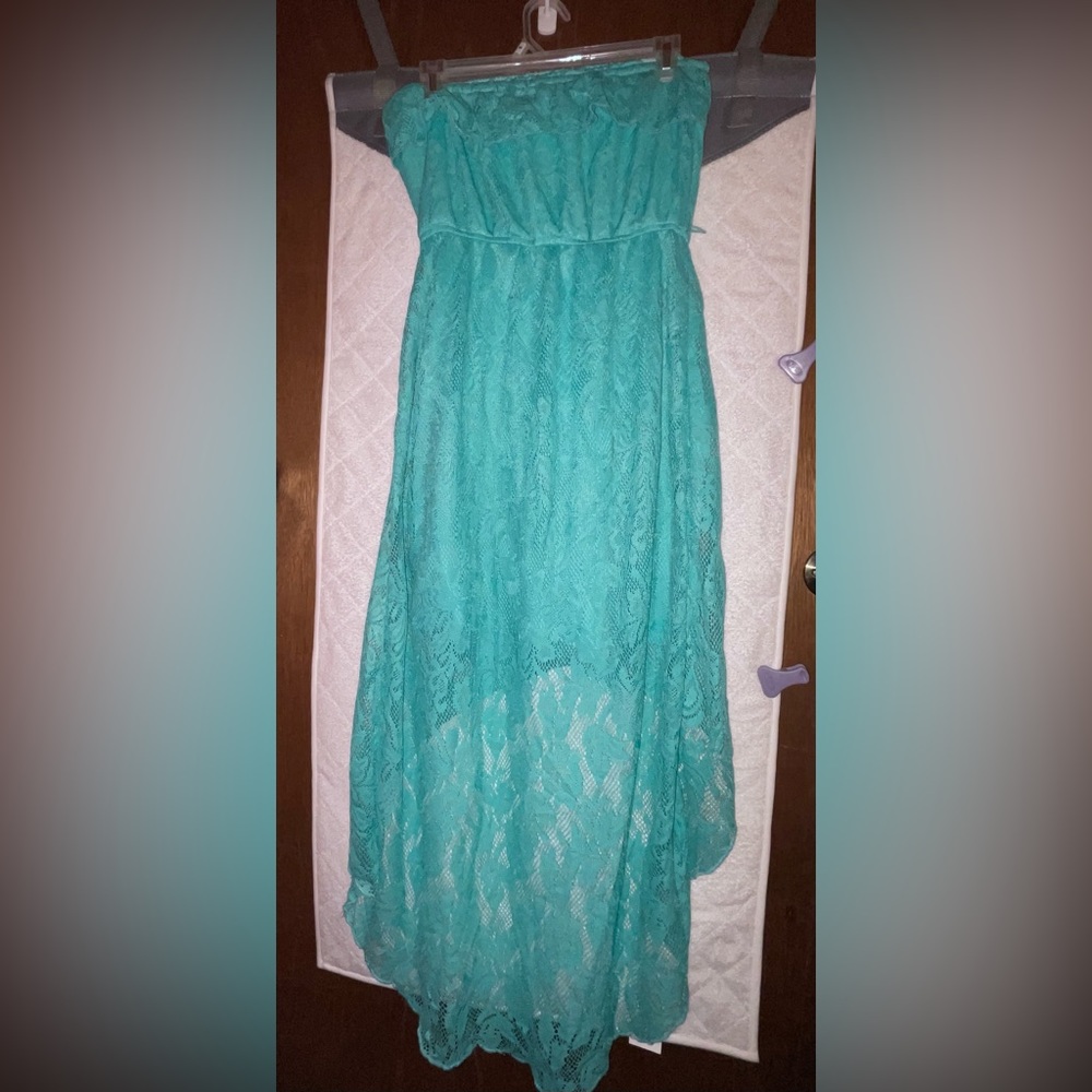 Teal blue strapless dress.